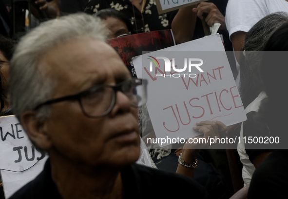 Artist professionals shout slogans and hold placards as part of a protest against the rape and murder of a trainee medic at a government-run...