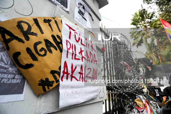 Posters reject the ratification of the Regional Head Election (Pilkada) Bill in front of the West Java DPRD Building in Bandung, Indonesia,...