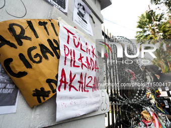 Posters reject the ratification of the Regional Head Election (Pilkada) Bill in front of the West Java DPRD Building in Bandung, Indonesia,...