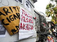 Posters reject the ratification of the Regional Head Election (Pilkada) Bill in front of the West Java DPRD Building in Bandung, Indonesia,...