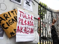 Posters reject the ratification of the Regional Head Election (Pilkada) Bill in front of the West Java DPRD Building in Bandung, Indonesia,...