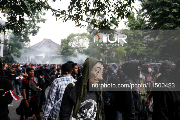 A protester wears a Money Heist mask during a protest against the revision of the Regional Head Election Bill (RUU) in front of the West Jav...