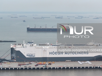 HOEGH AURORA, the world's largest and most environmentally friendly vehicle carrier, docks at Taicang Port Area to load vehicles on its maid...