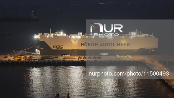 HOEGH AURORA, the world's largest and most environmentally friendly vehicle carrier, docks at Taicang Port Area to load vehicles on its maid...