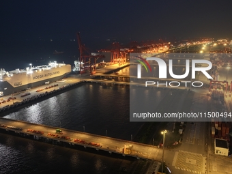 HOEGH AURORA, the world's largest and most environmentally friendly vehicle carrier, docks at Taicang Port Area to load vehicles on its maid...