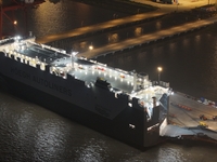 HOEGH AURORA, the world's largest and most environmentally friendly vehicle carrier, docks at Taicang Port Area to load vehicles on its maid...