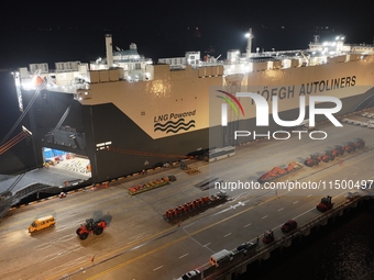 HOEGH AURORA, the world's largest and most environmentally friendly vehicle carrier, docks at Taicang Port Area to load vehicles on its maid...