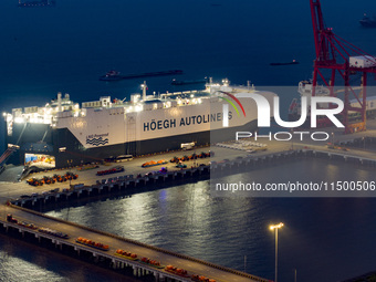 HOEGH AURORA, the world's largest and most environmentally friendly vehicle carrier, docks at Taicang Port Area to load vehicles on its maid...