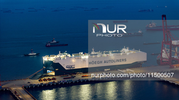 HOEGH AURORA, the world's largest and most environmentally friendly vehicle carrier, docks at Taicang Port Area to load vehicles on its maid...