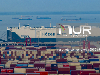 HOEGH AURORA, the world's largest and most environmentally friendly vehicle carrier, docks at Taicang Port Area to load vehicles on its maid...