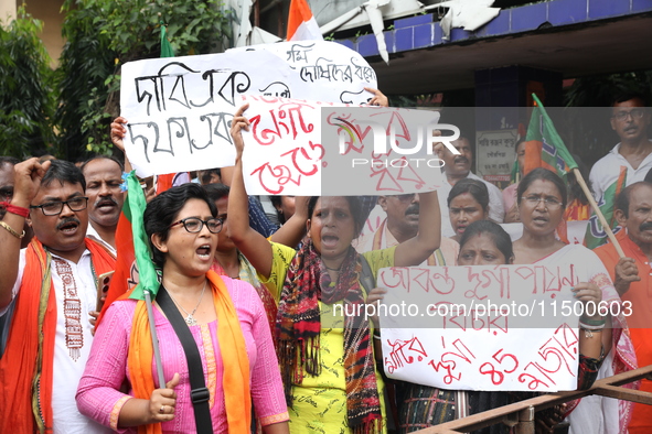 Bharatiya Janata Party (BJP) activists shout slogans during a protest rally as they go towards the State Health & Family Welfare Department...