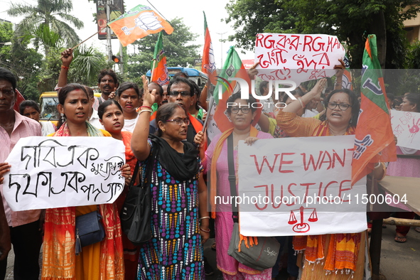 Bharatiya Janata Party (BJP) activists shout slogans during a protest rally as they go towards the State Health & Family Welfare Department...