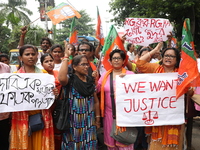 Bharatiya Janata Party (BJP) activists shout slogans during a protest rally as they go towards the State Health & Family Welfare Department...