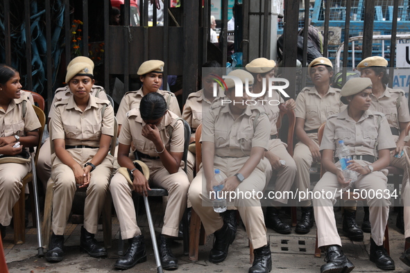 The police force sits guard inside R G Kar Medical College and Hospital while medical students protest against the rape and murder of a PGT...