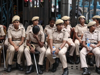 The police force sits guard inside R G Kar Medical College and Hospital while medical students protest against the rape and murder of a PGT...