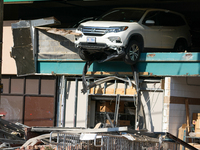 A car drives through the barrier at the Whole Foods in Tenleytown, Washington, DC, damaging the entrance to a Wawa convenience store. No one...