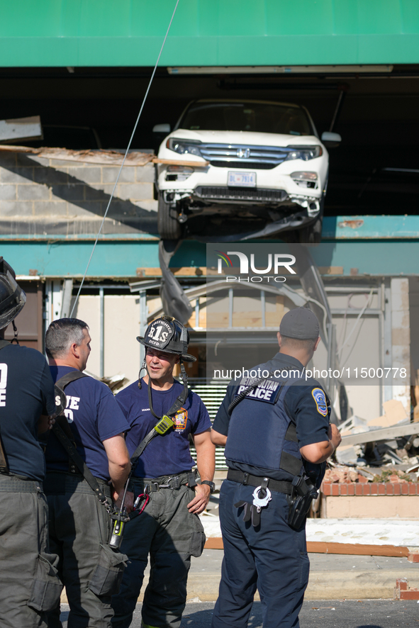 A car drives through the barrier at the Whole Foods in Tenleytown, Washington, DC, damaging the entrance to a Wawa convenience store. No one...