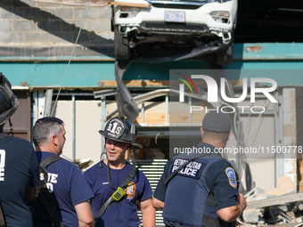 A car drives through the barrier at the Whole Foods in Tenleytown, Washington, DC, damaging the entrance to a Wawa convenience store. No one...