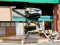 A car drives through the barrier at the Whole Foods in Tenleytown, Washington, DC, damaging the entrance to a Wawa convenience store. No one...