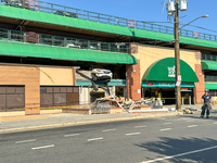 A car drives through the barrier at the Whole Foods in Tenleytown, Washington, DC, damaging the entrance to a Wawa convenience store. No one...