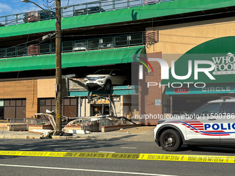 A car drives through the barrier at the Whole Foods in Tenleytown, Washington, DC, damaging the entrance to a Wawa convenience store. No one...