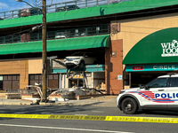 A car drives through the barrier at the Whole Foods in Tenleytown, Washington, DC, damaging the entrance to a Wawa convenience store. No one...