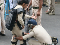 The police force prepares to stop Bharatiya Janata Party (BJP) activists as they go towards the Swasthya Bhawan or State Health & Family Wel...