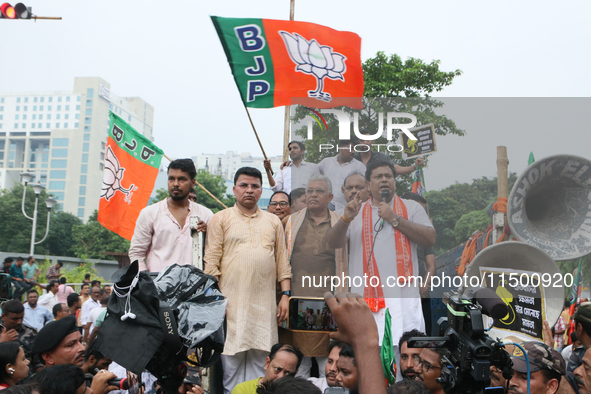 Bharatiya Janata Party's (BJP) state president Sukanta Majumdar speaks with BJP senior leaders Dilip Ghosh and others near 'Swasthya Bhawan'...