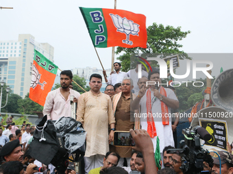 Bharatiya Janata Party's (BJP) state president Sukanta Majumdar speaks with BJP senior leaders Dilip Ghosh and others near 'Swasthya Bhawan'...