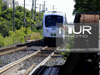 A passenger commuter train travels on the same rail corridor through the Brampton Innovation District that Canadian National Railway operate...