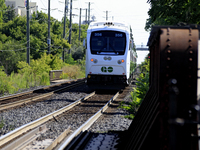 A passenger commuter train travels on the same rail corridor through the Brampton Innovation District that Canadian National Railway operate...