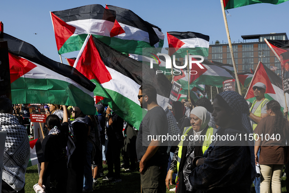 Pro-Palestinian protesters demonstrate at the Chicago Transit Authority (CTA) subway platform on the Damen Avenue/Lake Street station during...