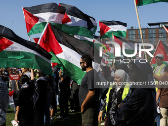 Pro-Palestinian protesters demonstrate at the Chicago Transit Authority (CTA) subway platform on the Damen Avenue/Lake Street station during...