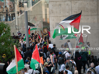 Pro-Palestinian activists marched through the streets of Chicago on August 21, 2024, to protest the Democratic National Committee's conventi...