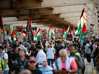 Pro-Palestinian activists marched through the streets of Chicago on August 21, 2024, to protest the Democratic National Committee's conventi...