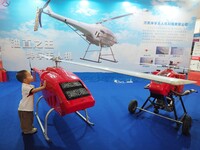 Visitors view an ''unmanned helicopter'' at the 2024 World Robot Conference in Beijing, China, on August 22, 2024. (