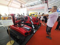 Visitors view a ''fire-fighting robot'' at the 2024 World Robot Conference in Beijing, China, on August 22, 2024. (