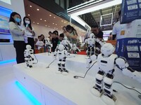 Visitors visit a ''wise teaching robot'' at the 2024 World Robot Conference in Beijing, China, on August 22, 2024. (