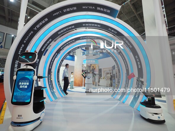 Visitors view a ''service robot'' at the 2024 World Robot Conference in Beijing, China, on August 22, 2024. 