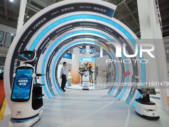 Visitors view a ''service robot'' at the 2024 World Robot Conference in Beijing, China, on August 22, 2024. (