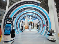 Visitors view a ''service robot'' at the 2024 World Robot Conference in Beijing, China, on August 22, 2024. (