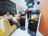 Visitors visit a ''food delivery robot'' at the 2024 World Robot Conference in Beijing, China, on August 22, 2024. (