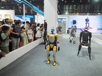 Visitors watch a robot performance at the 2024 World Robot Conference in Beijing, China, on August 22, 2024. (