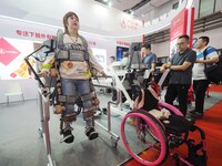 Visitors experience a ''lower limb exoskeleton robot'' at the 2024 World Robot Conference in Beijing, China, on August 22, 2024. (