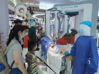 Visitors view a ''surgical robot'' at the 2024 World Robot Conference in Beijing, China, on August 22, 2024. (