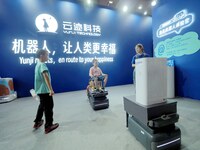 Visitors experience the ''UP robot'' at the 2024 World Robot Conference in Beijing, China, on August 22, 2024. (