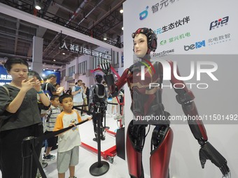 Visitors view a ''humanoid robot'' at the 2024 World Robot Conference in Beijing, China, on August 22, 2024. (