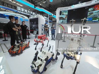 Visitors visit the ''Public Safety Series robots'' at the 2024 World Robot Conference in Beijing, China, on August 22, 2024. (