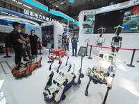 Visitors visit the ''Public Safety Series robots'' at the 2024 World Robot Conference in Beijing, China, on August 22, 2024. (