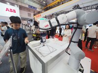 Visitors visit an ''educational robot'' at the 2024 World Robot Conference in Beijing, China, on August 22, 2024. (